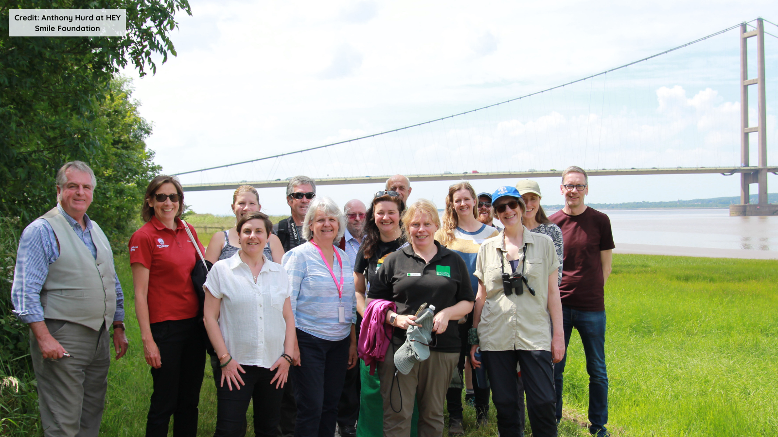 Group walk, group photo of workshop attendees with bridge in background
